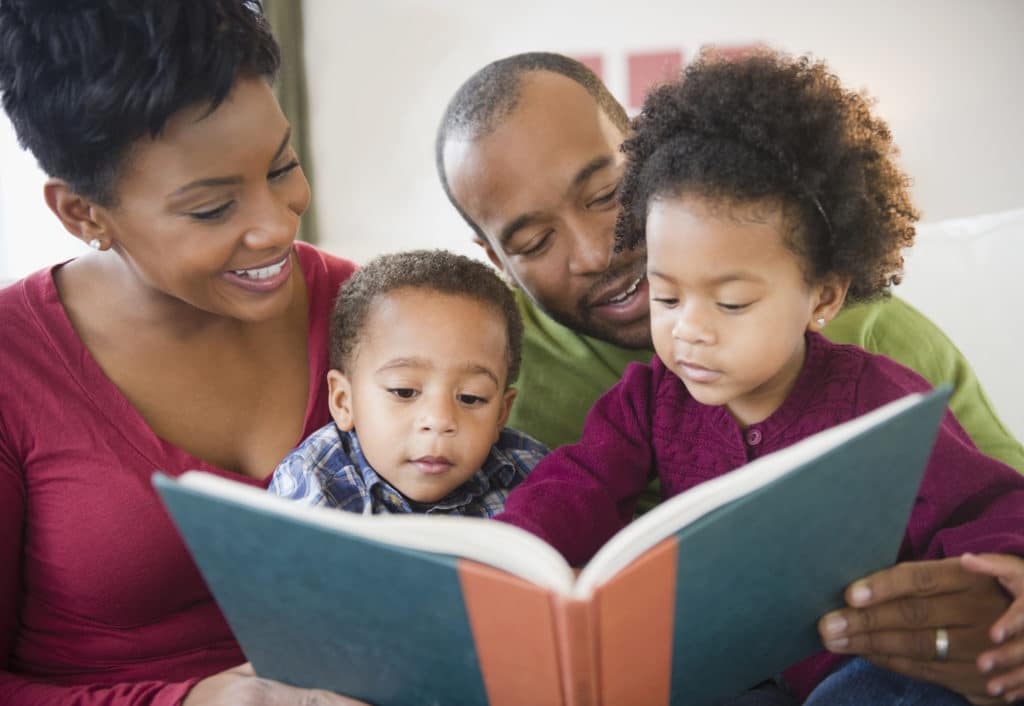 whole family reading a book together