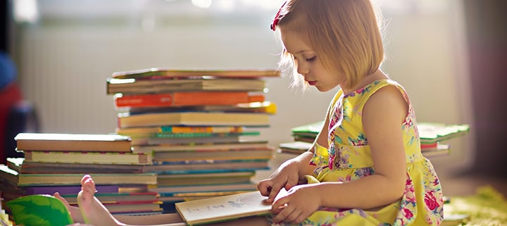 young girl child reading book books