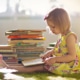 young girl child reading book books