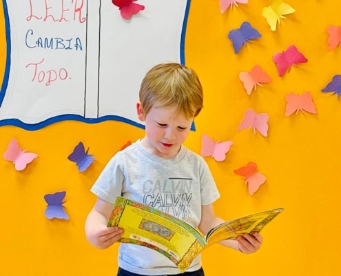 a toddler reading a book