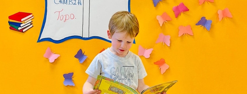 a toddler reading a book