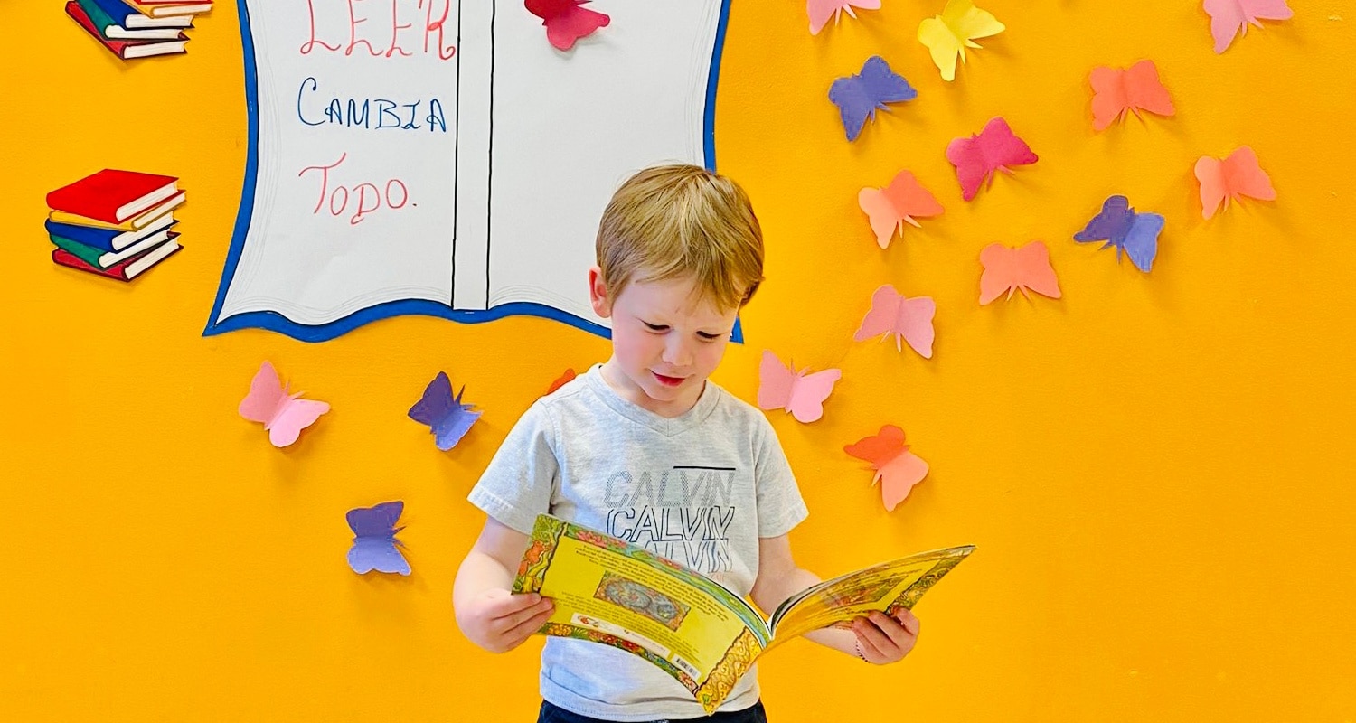 a toddler reading a book