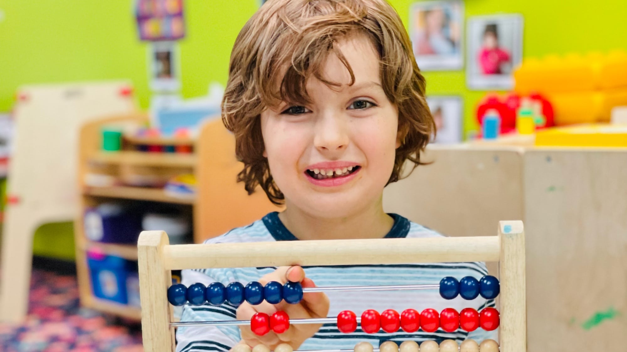 preschooler using an abacus