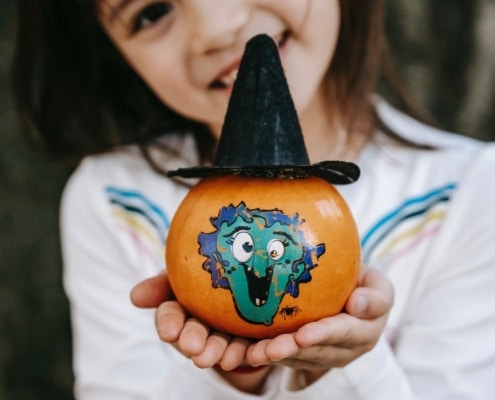 little girl doing fall crafts for kids