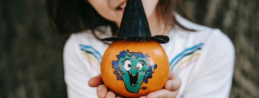 little girl doing fall crafts for kids