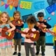 preschool kids playing mexican guitar