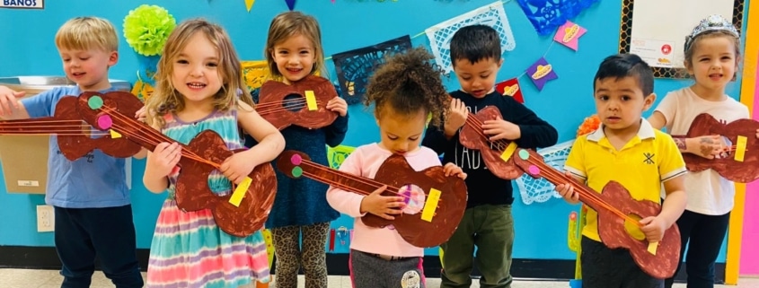 preschool kids playing mexican guitar