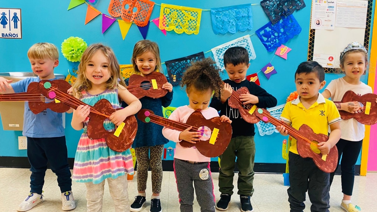 preschool kids playing mexican guitar