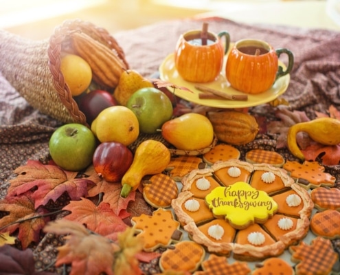 thanksgiving spread with cookies and pumpkin spice beverage