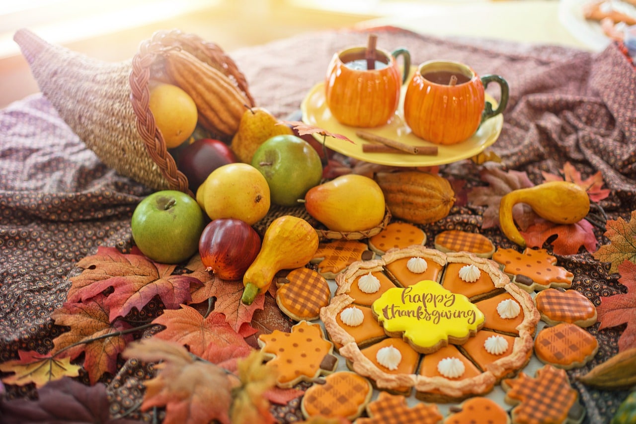 thanksgiving spread with cookies and pumpkin spice beverage