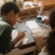 two children making winter craft ideas for kids