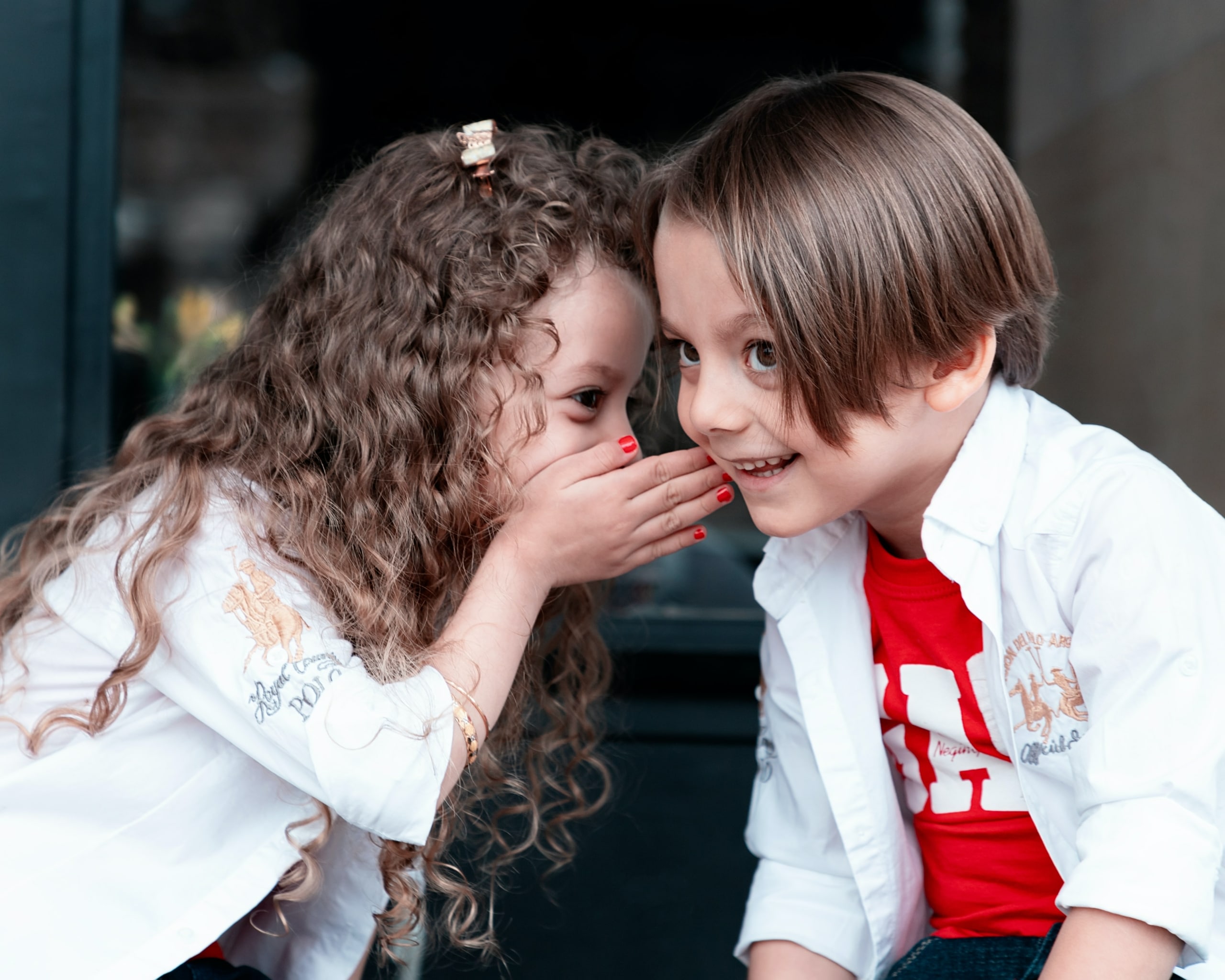 two kids playing listening games