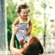mother lifting her kid up