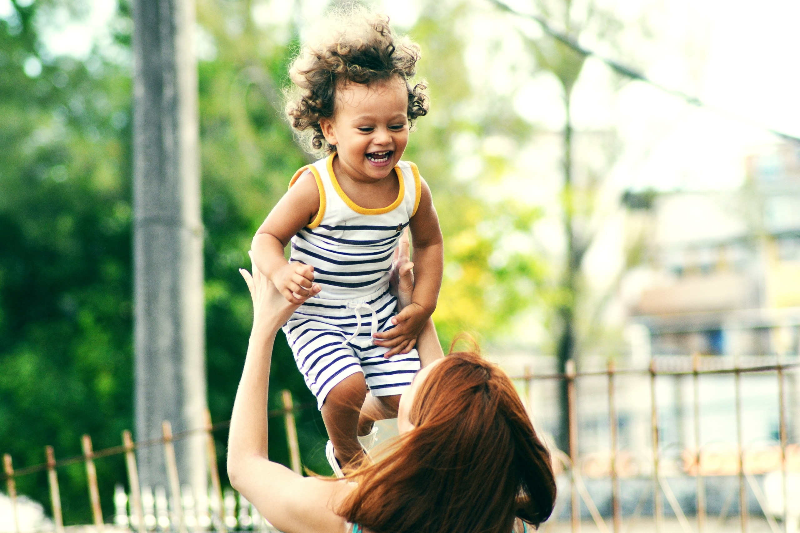 mother lifting her kid up