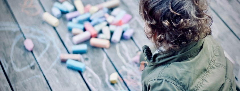 child playing with chalk for self-regulation