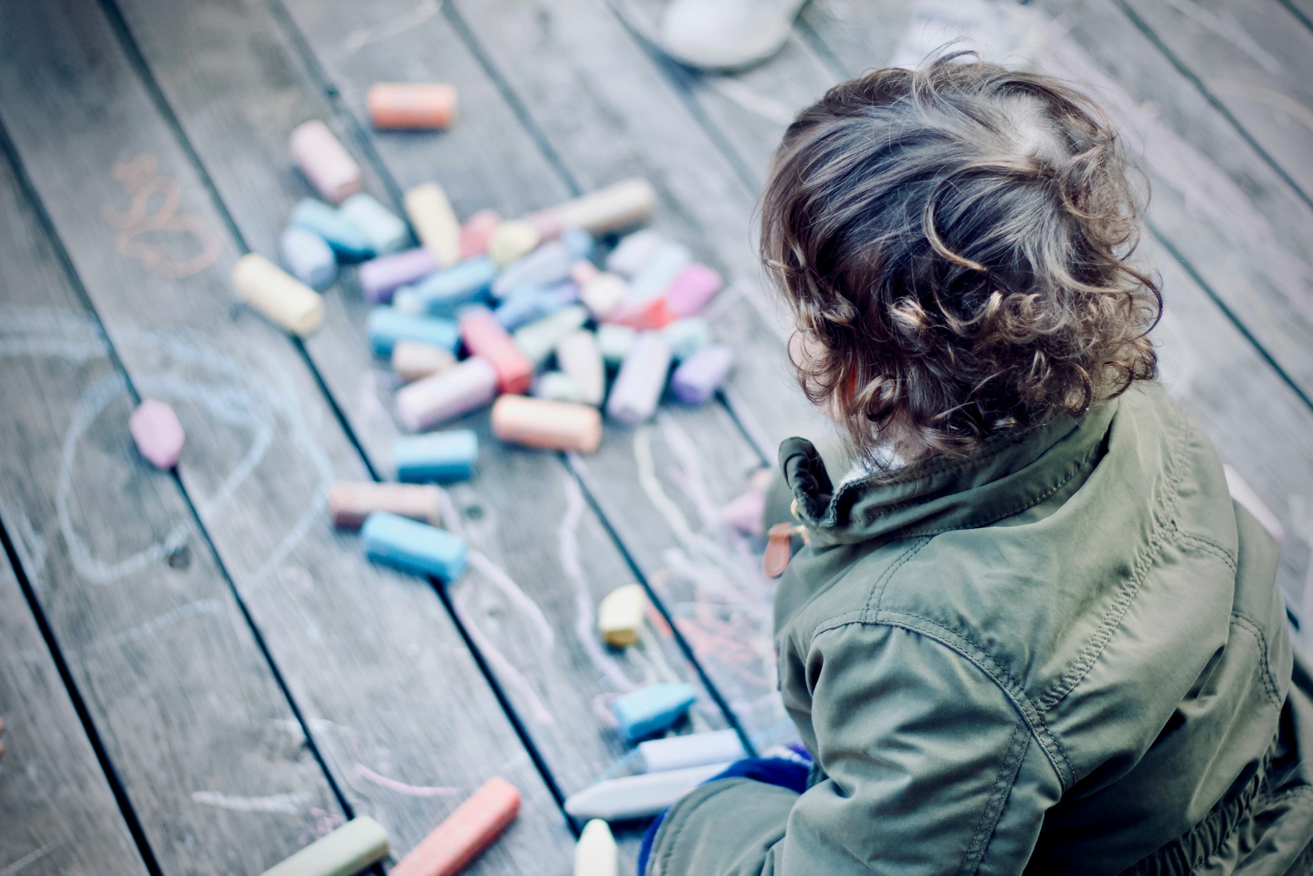 child playing with chalk for self-regulation