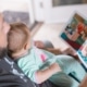 parent and toddler reading a book