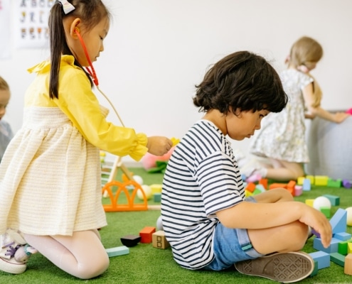 child having trouble adjusting to preschool during playtime