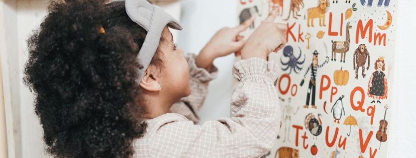 little girl reading is my child ready for preschool