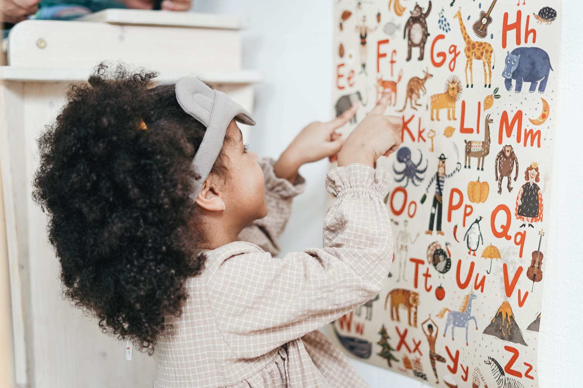 little girl reading is my child ready for preschool