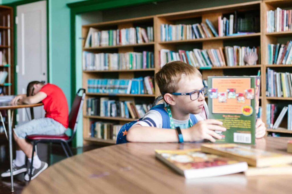Child reading book in school