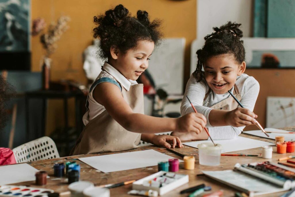 Little girls painting together