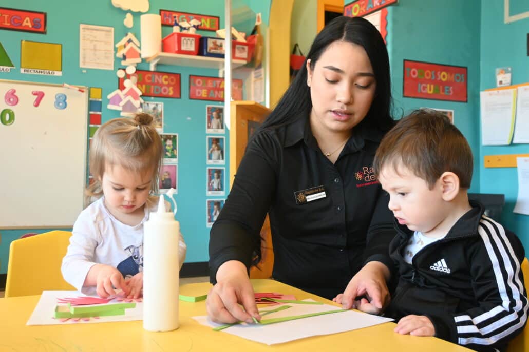 teacher with toddlers in classroom